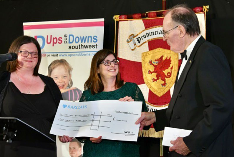 An evening of Celebration - Michelle and Michelle receiving the Cheque from the Knights Templars